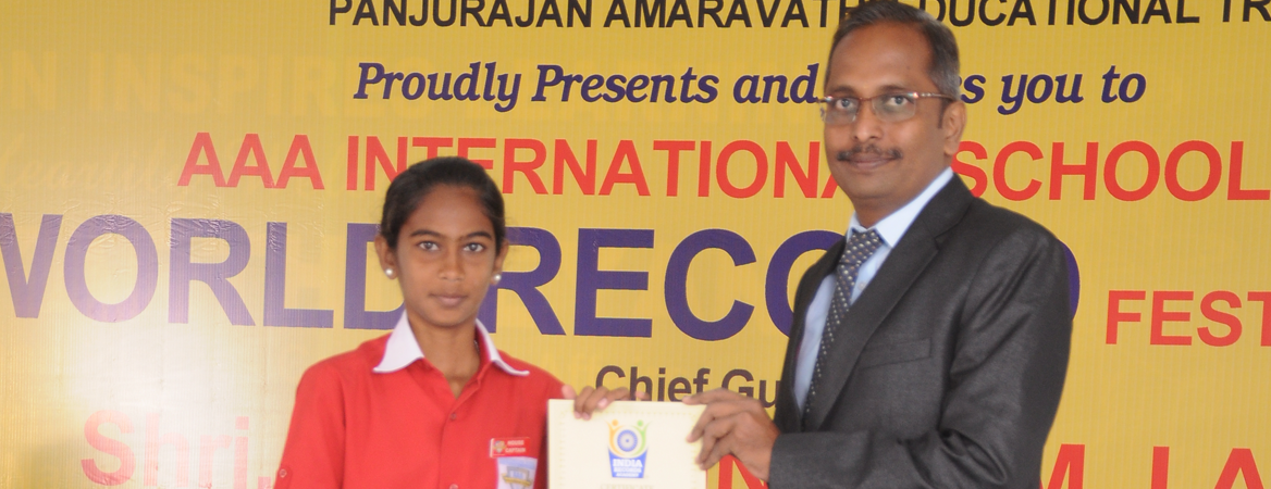 Indian Book of Records certificate presented to a young achiever at an award ceremony